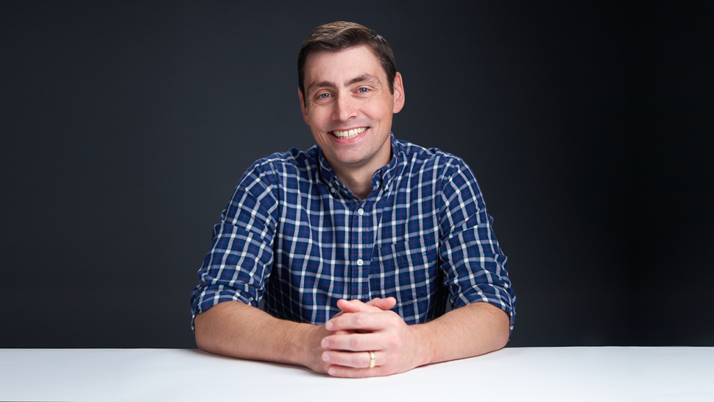 Ross Eaton sitting at desk